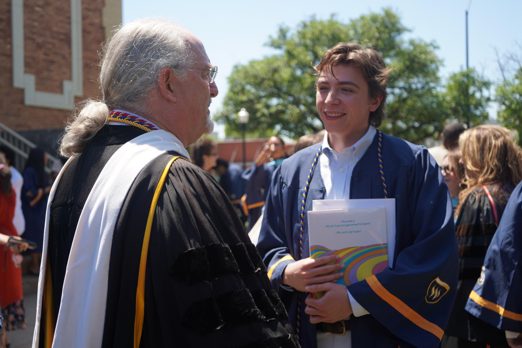 Graduating students embrace new beginnings at Robing and Hooding Ceremony
