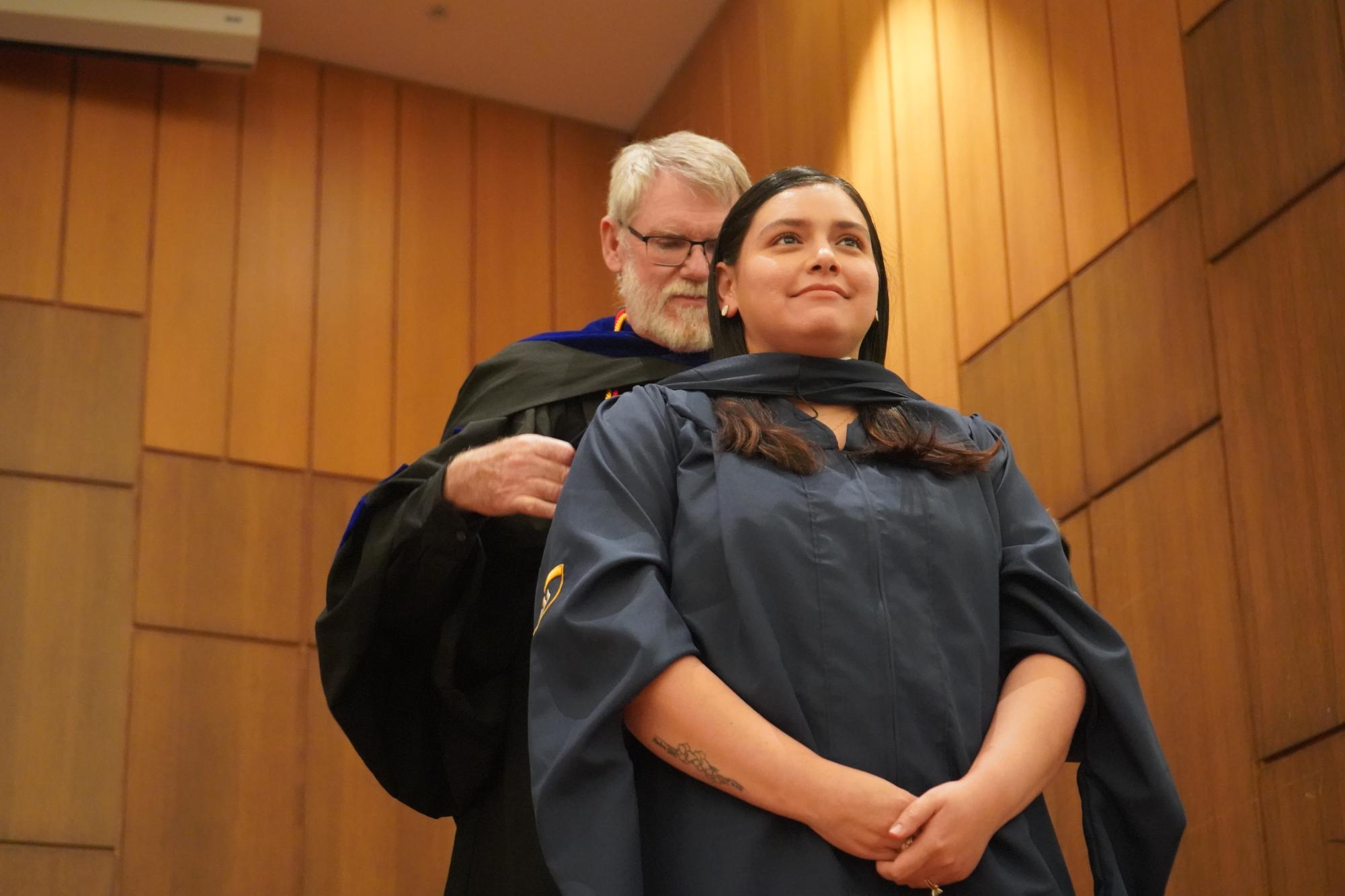 Graduating students embrace new beginnings at Robing and Hooding Ceremony