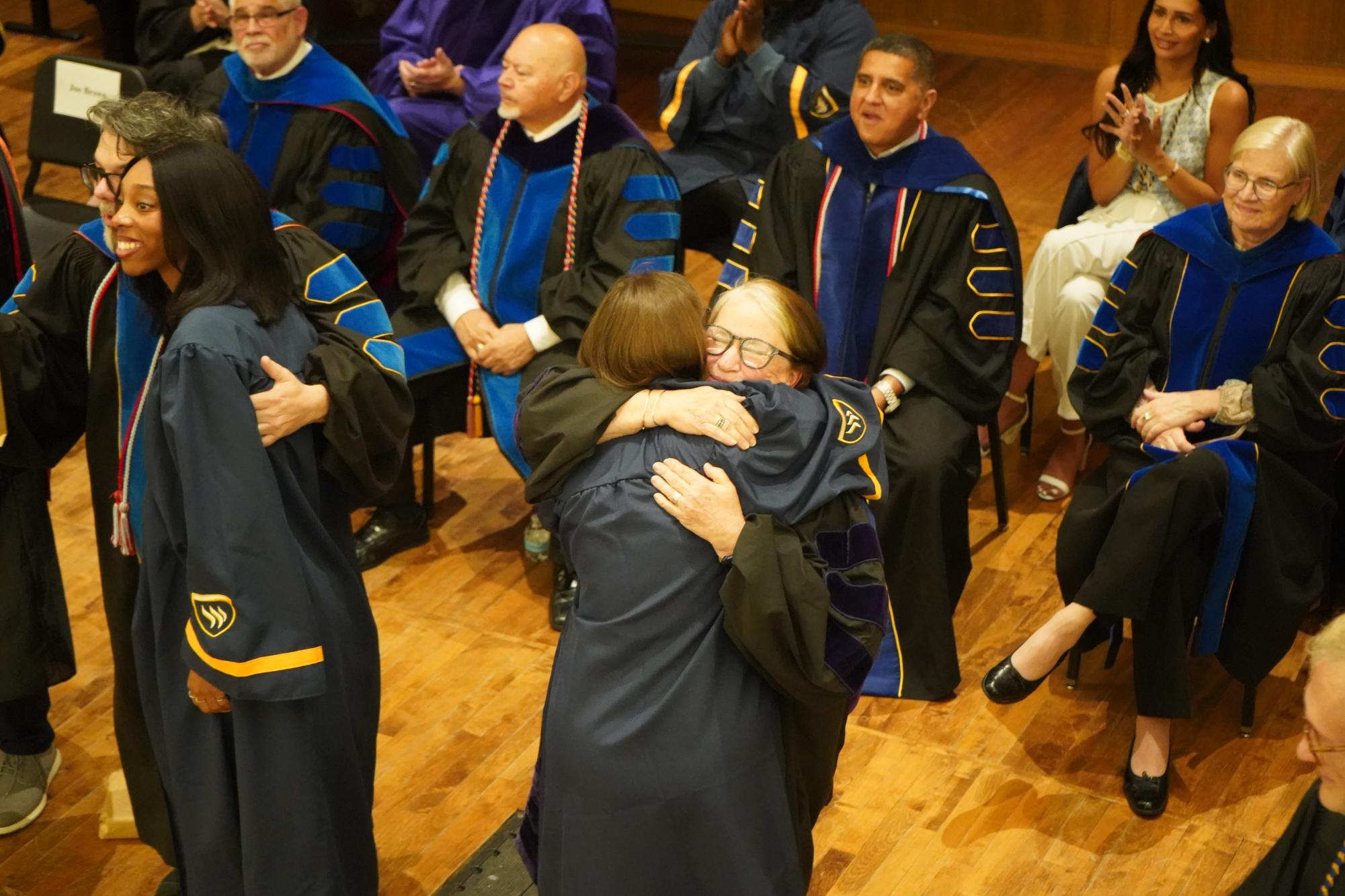 Graduating students embrace new beginnings at Robing and Hooding Ceremony