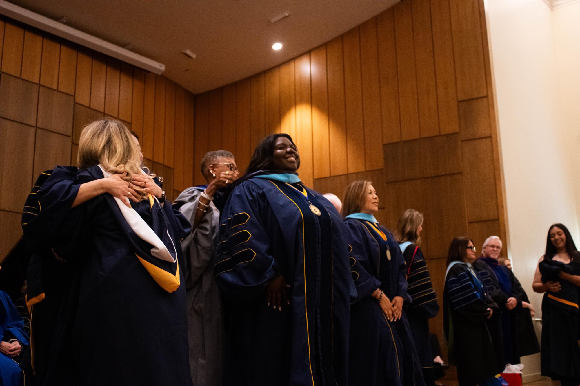Graduating students embrace new beginnings at Robing and Hooding Ceremony
