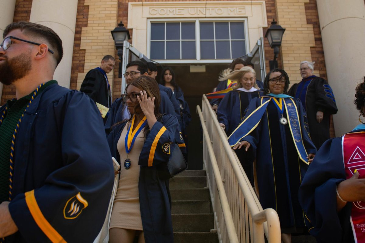 Students flood out of the McFadden Science Center following the conclusion of the Robing and Hooding Convocation.