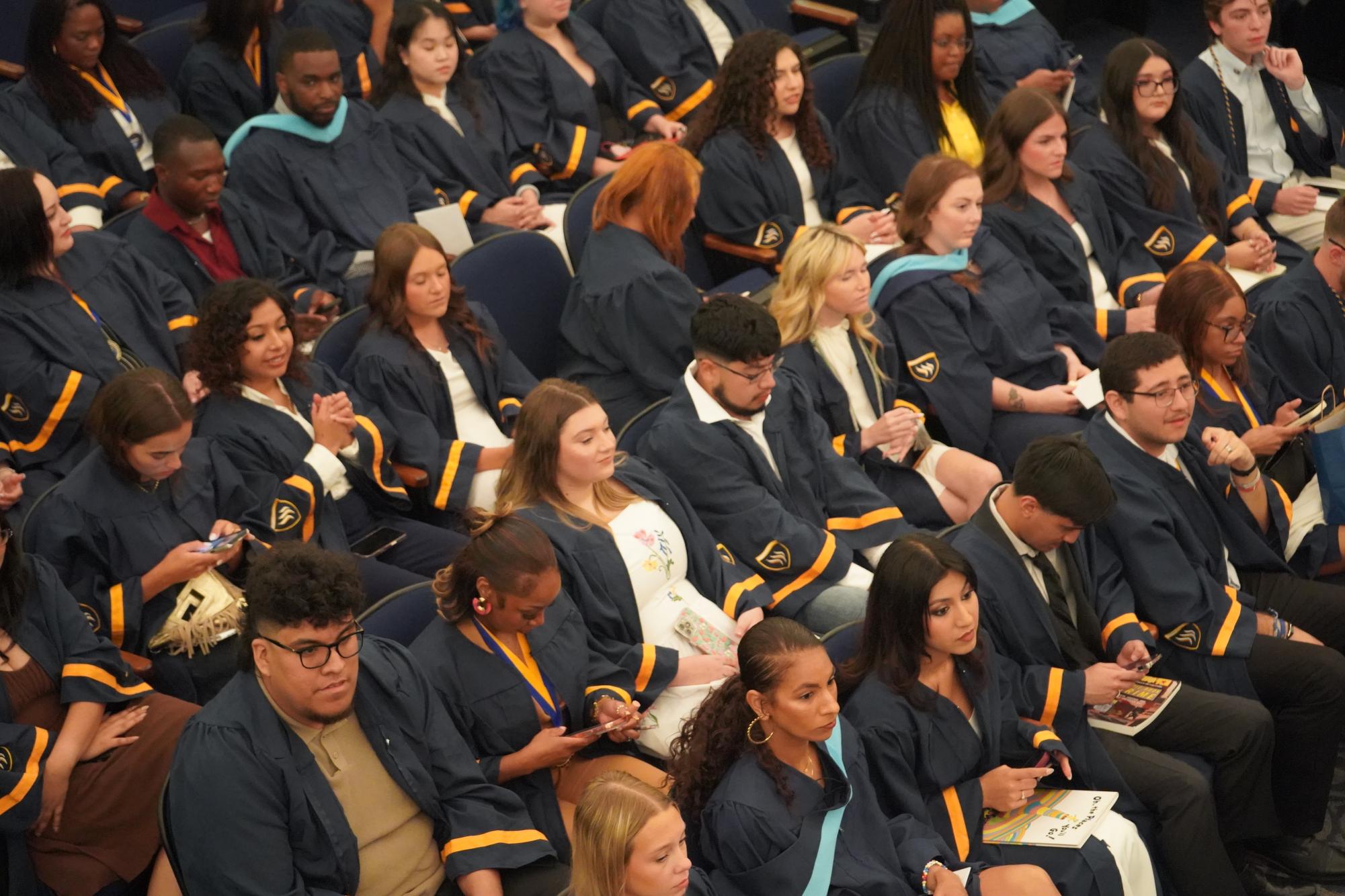 Graduating students embrace new beginnings at Robing and Hooding Ceremony